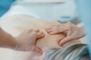 Registered Massage Therapist providing massage to the Patient at Surrey 88 Ave Physiotherapy & Sports Injury Clinic